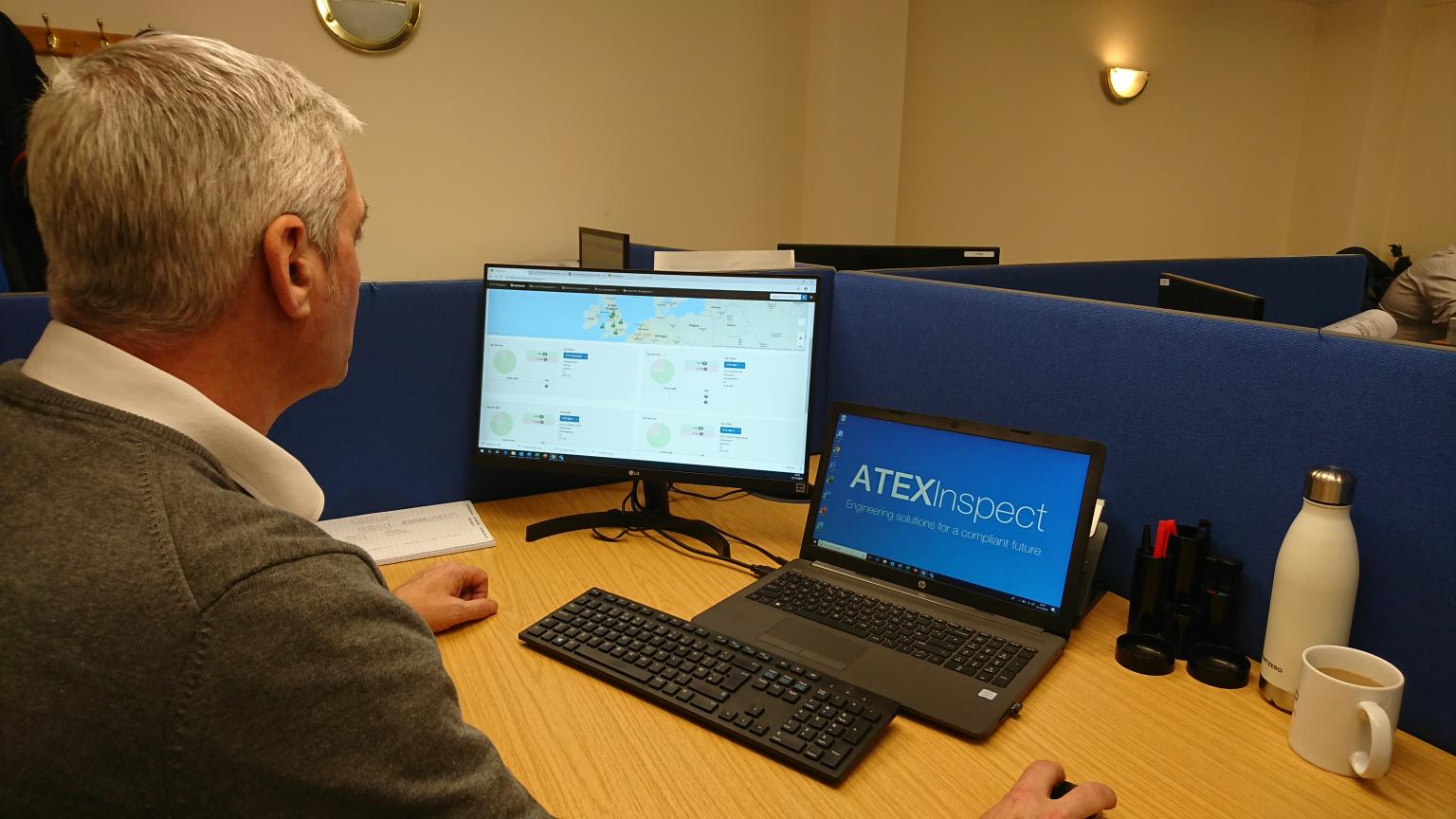 Site manager reviewing inspections and faults from the office
